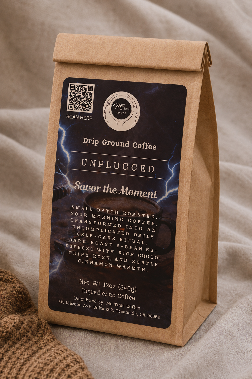 A kraft paper coffee bag labeled 'Unplugged' drip ground coffee by Mr. Time Coffee, set against a soft beige fabric background with a burlap texture in the lower left corner.